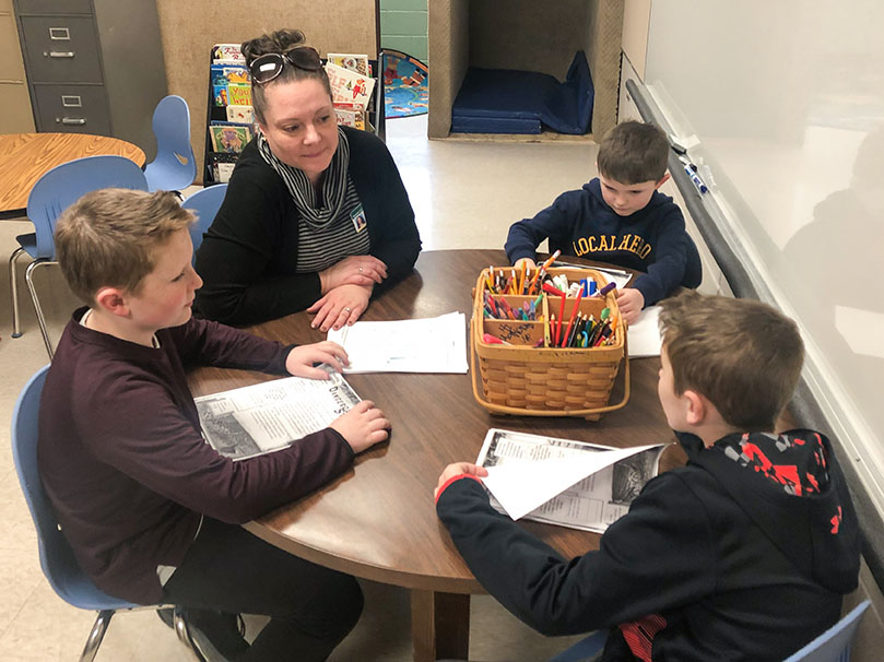 Allison Slone works with a group of students in a classroom at McBrayer Elementary School (Rowan County).