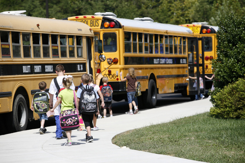 Photo of children walking toward a Kentucky school bus.